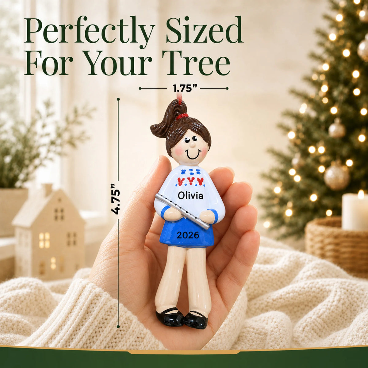 Size guide: the personalized flute girl christmas ornament is 1.75 in wide by 4.75 in tall, shown in hand