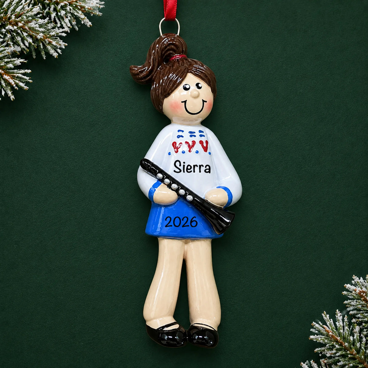 Personalized clarinet girl christmas ornament on a dark green pine background