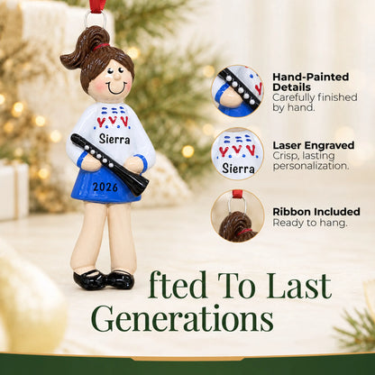 Hand-painted details and laser engraved personalization on the clarinet girl christmas ornament, ribbon included