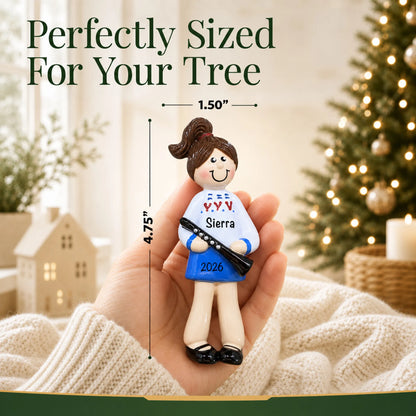 Size guide: the personalized clarinet girl christmas ornament is 1.50 in wide by 4.75 in tall, shown in hand