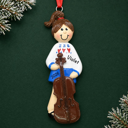 Personalized cello girl christmas ornament on a dark green pine background
