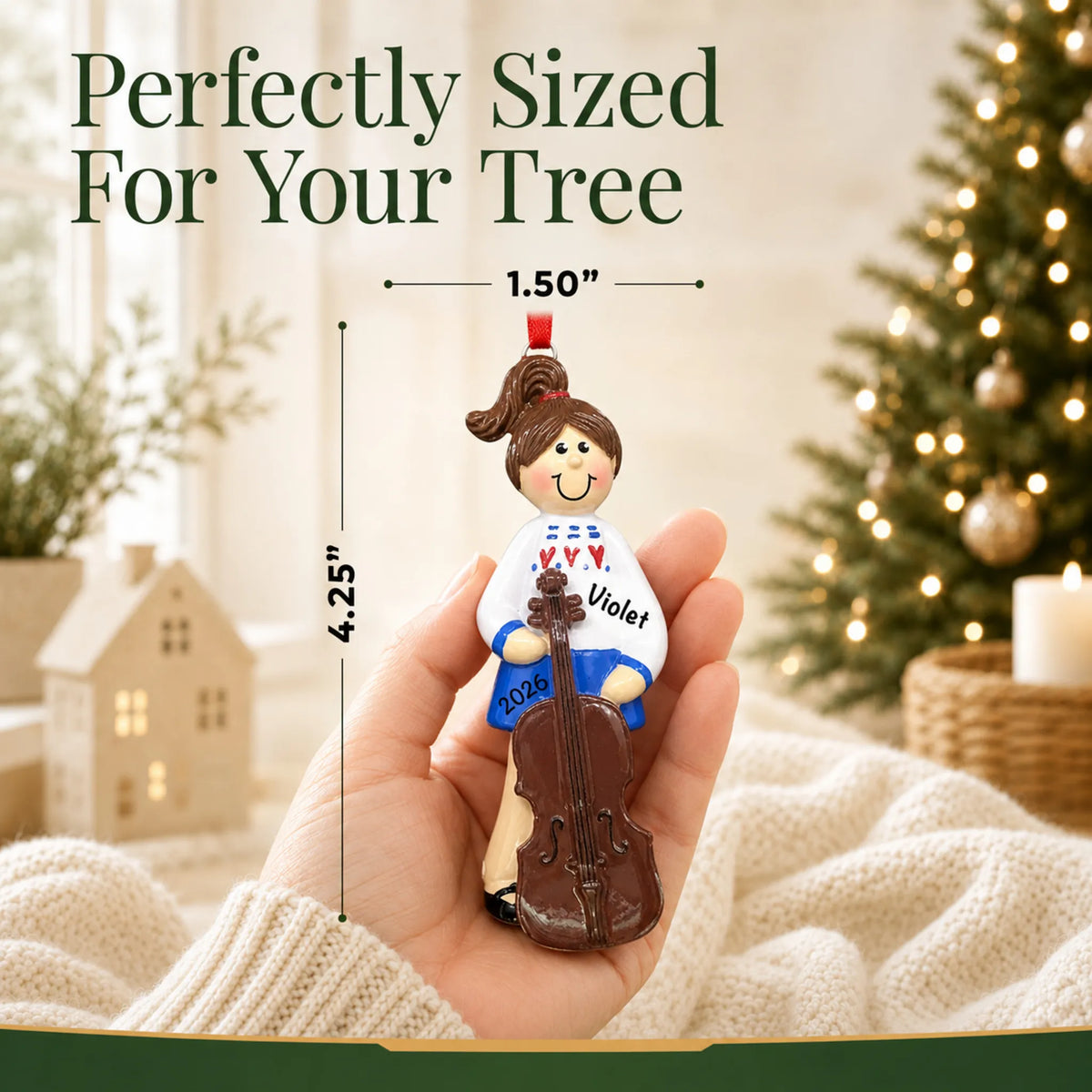 Size guide: the personalized cello girl christmas ornament is 1.50 in wide by 4.25 in tall, shown in hand