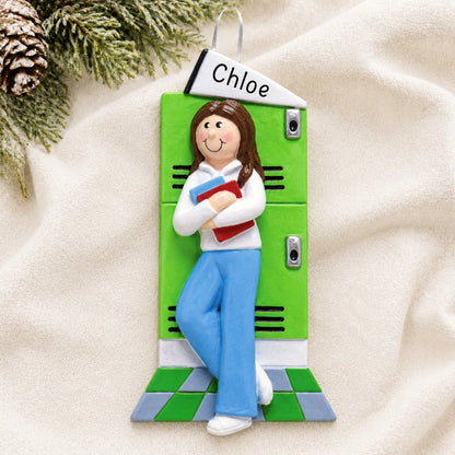 Personalized brunette school girl Christmas ornament shown on a soft white blanket