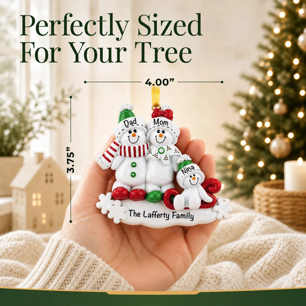 Size guide: the personalized snowman sled family of 3 christmas ornament is 4.00 in wide by 3.75 in tall, shown in hand
