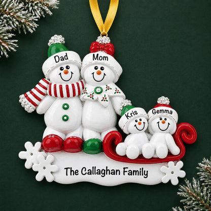 Personalized snowman sled family of 4 christmas ornament on a dark green pine background