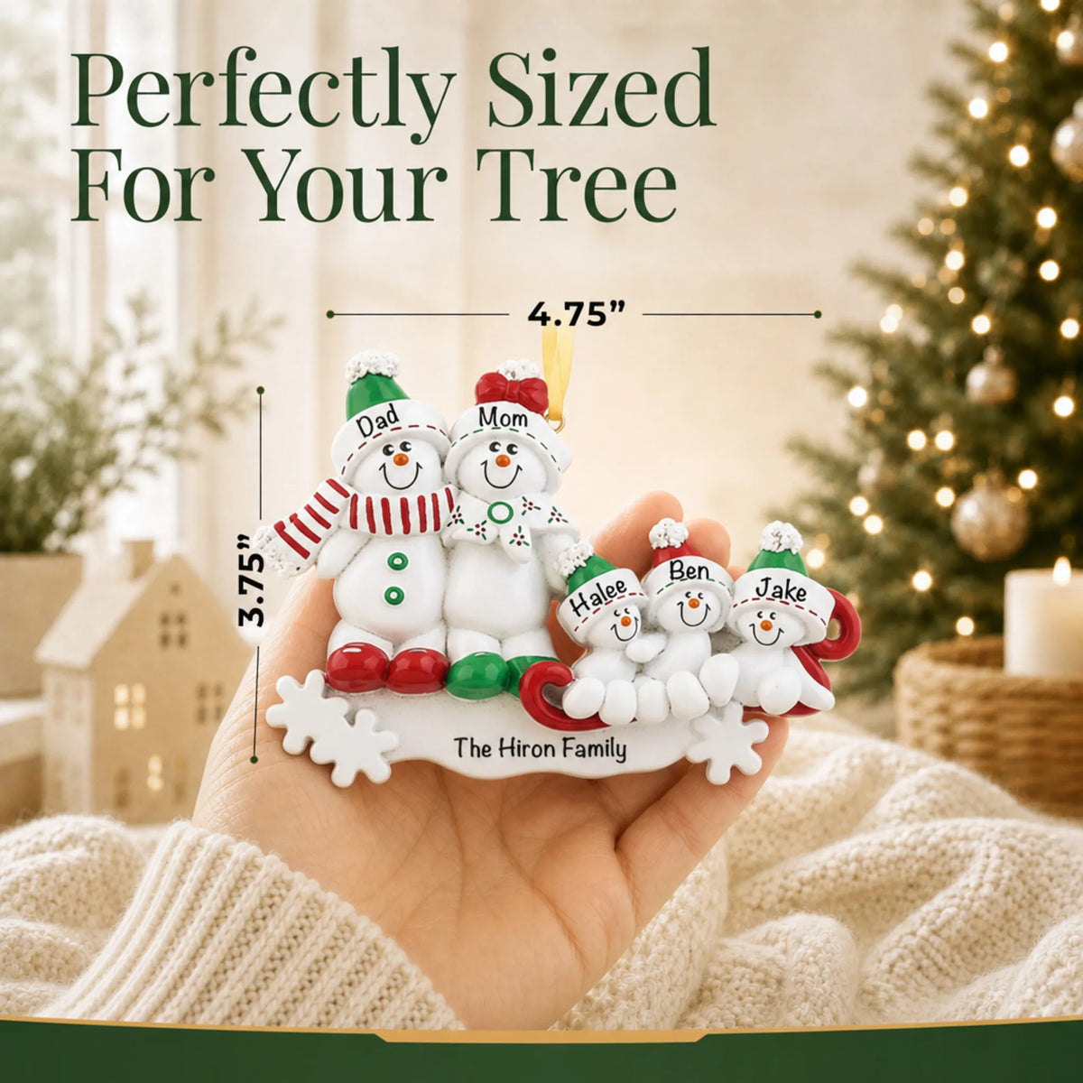 Size guide: the personalized snowman sled family of 5 christmas ornament is 4.75 in wide by 3.75 in tall, shown in hand