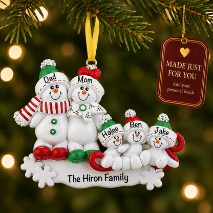 Snowman sled family of 5 christmas ornament hanging on a lit Christmas tree with a Made Just For You gift tag