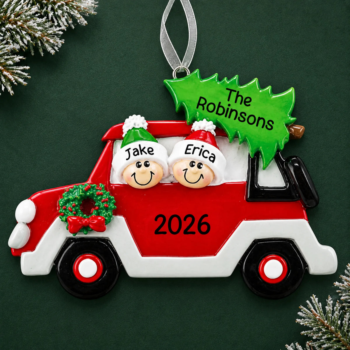 Personalized christmas tree car couple ornament on a dark green pine background
