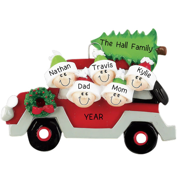 A resin ornament featuring a red and white car with a green Christmas tree and five cartoon figures representing a family of five, with personalized text including names and the year.