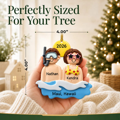 Size guide: the personalized beach & sea couple christmas ornament is 4.00 in wide by 4.00 in tall, shown in hand