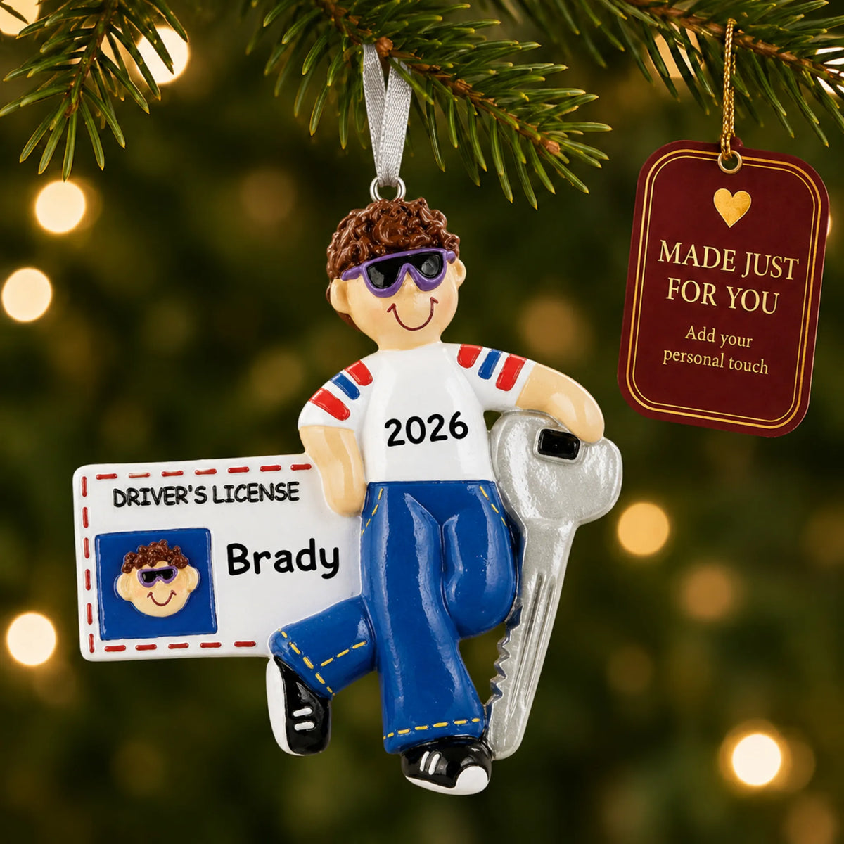 New Driver's License Boy christmas ornament hanging on a lit Christmas tree with a Made Just For You gift tag