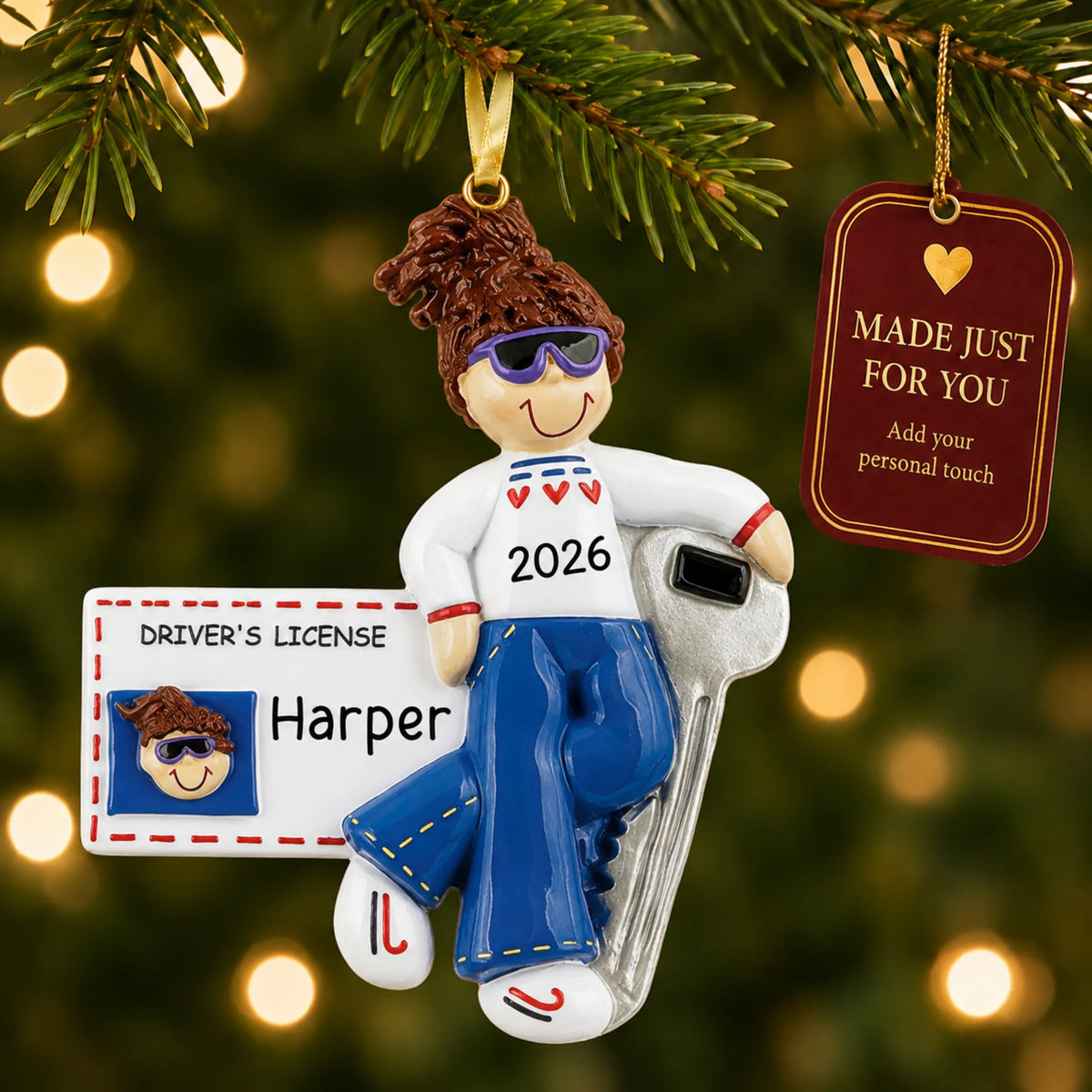 New Driver Brunette Girl christmas ornament hanging on a lit Christmas tree with a Made Just For You gift tag
