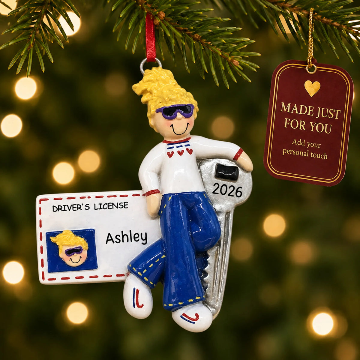 New driver blonde girl christmas ornament hanging on a lit Christmas tree with a Made Just For You gift tag