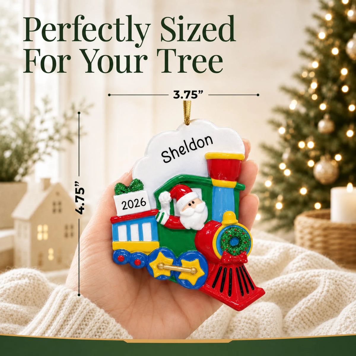 Size guide: the personalized Santa Train christmas ornament is 3.75 in wide by 4.75 in tall, shown in hand