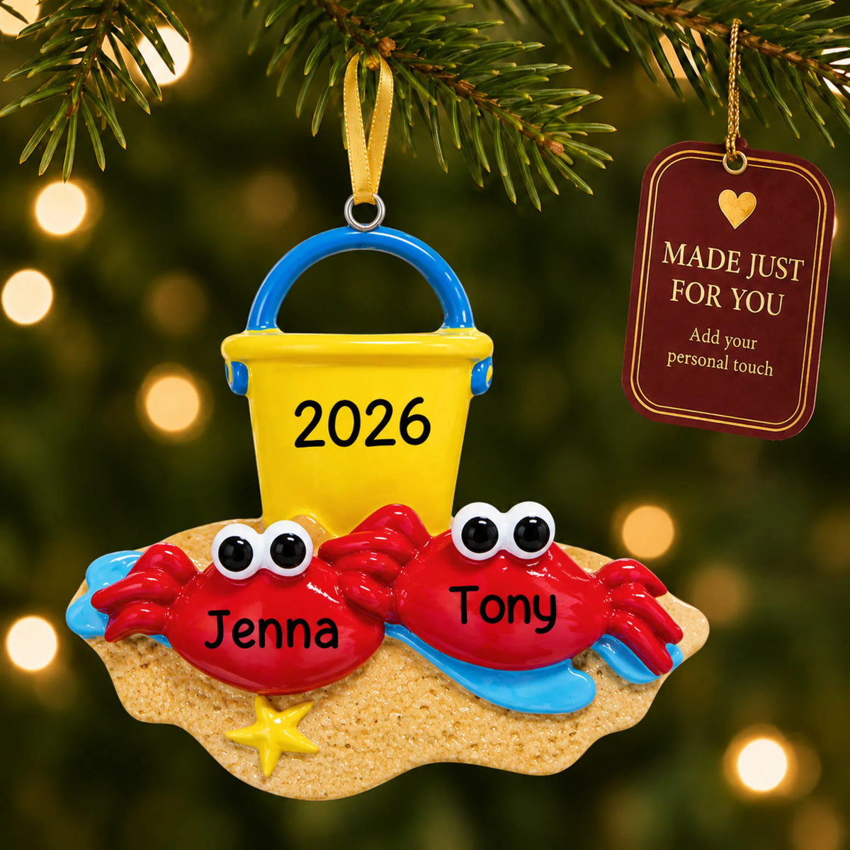 Crab couple beach christmas ornament hanging on a lit Christmas tree with a Made Just For You gift tag