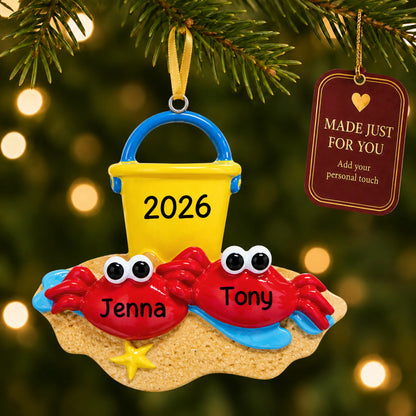 Crab couple beach christmas ornament hanging on a lit Christmas tree with a Made Just For You gift tag