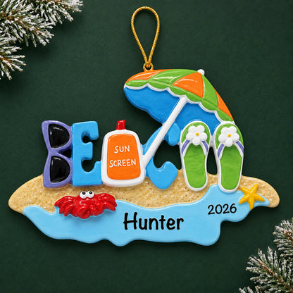 Personalized beach bum christmas ornament on a dark green pine background