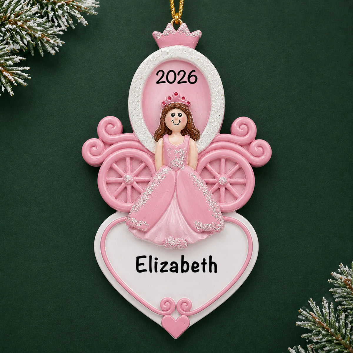 Personalized princess carriage christmas ornament on a dark green pine background