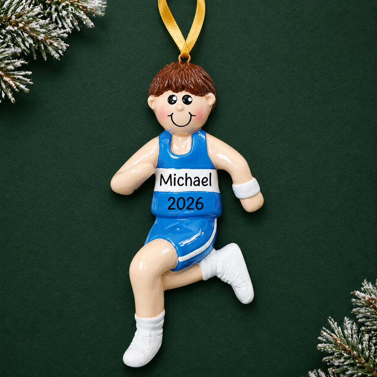 Personalized track runner boy christmas ornament on a dark green pine background