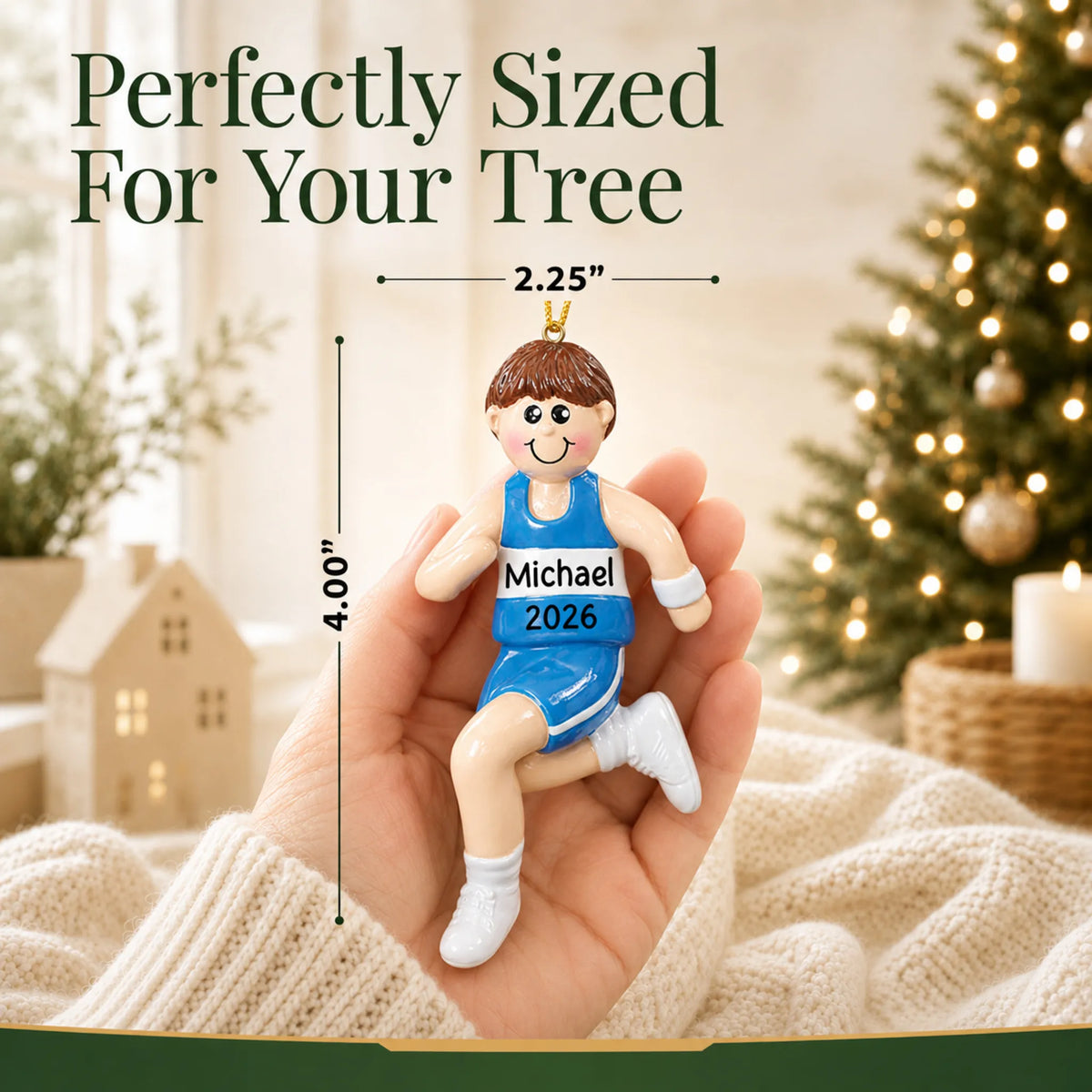 Size guide: the personalized track runner boy christmas ornament is 2.25 in wide by 4.00 in tall, shown in hand