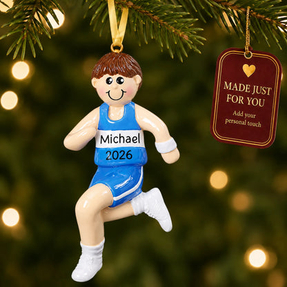 Track runner boy christmas ornament hanging on a lit Christmas tree with a Made Just For You gift tag