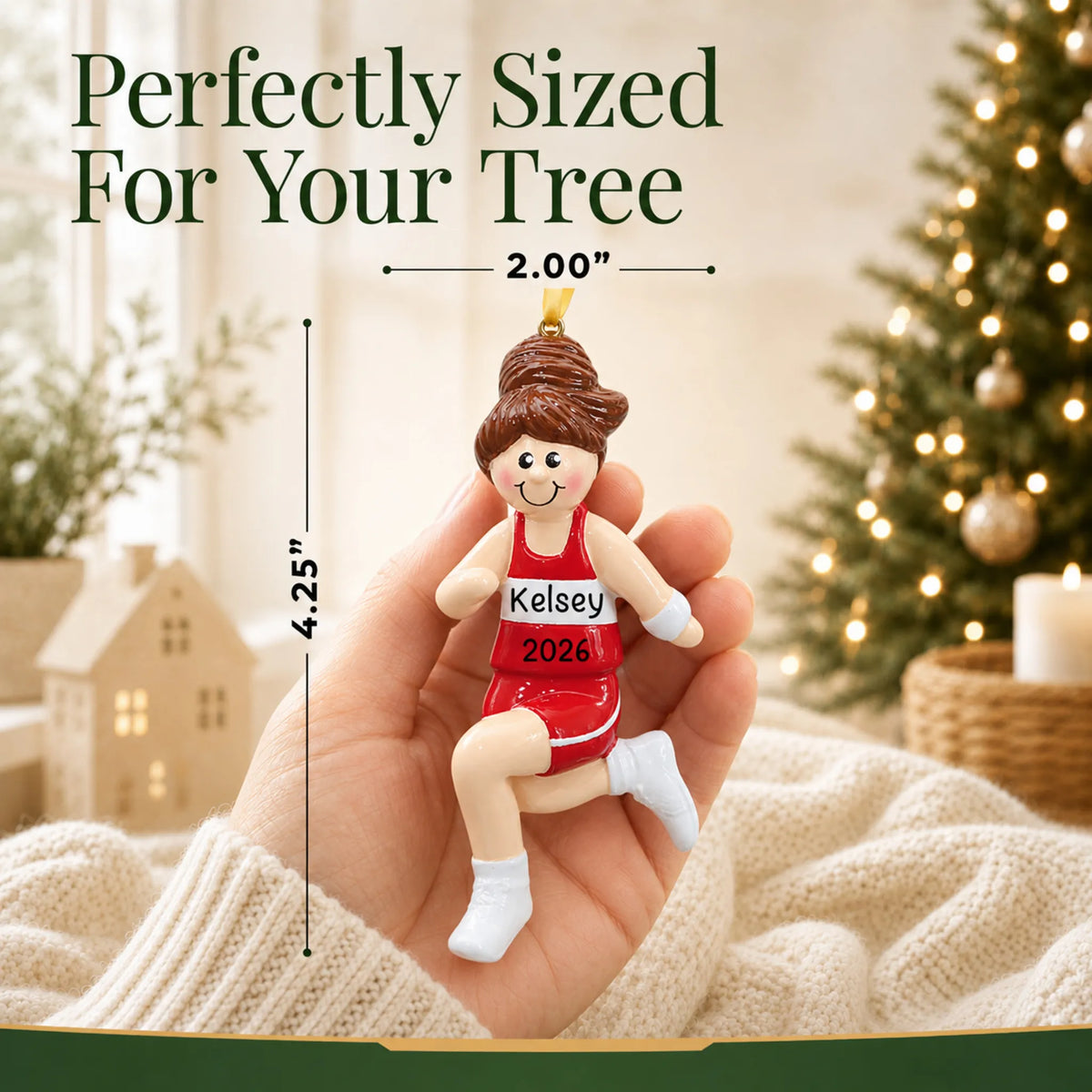 Size guide: the personalized track girl runner christmas ornament is 2.00 in wide by 4.25 in tall, shown in hand