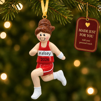 Track girl runner christmas ornament hanging on a lit Christmas tree with a Made Just For You gift tag