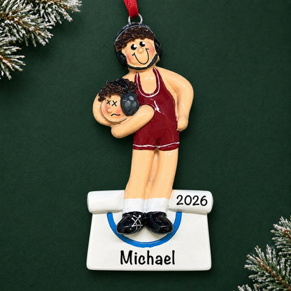 Personalized male wrestler in a red singlet christmas ornament on a dark green pine background
