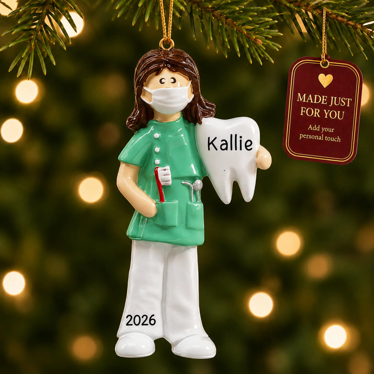 Female dental professional christmas ornament hanging on a lit Christmas tree with a Made Just For You gift tag