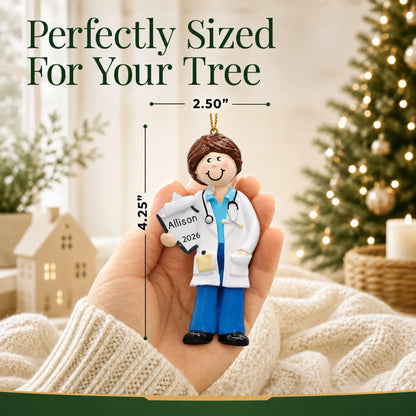 Size guide: the personalized doctor girl christmas ornament is 2.50 in wide by 4.25 in tall, shown in hand