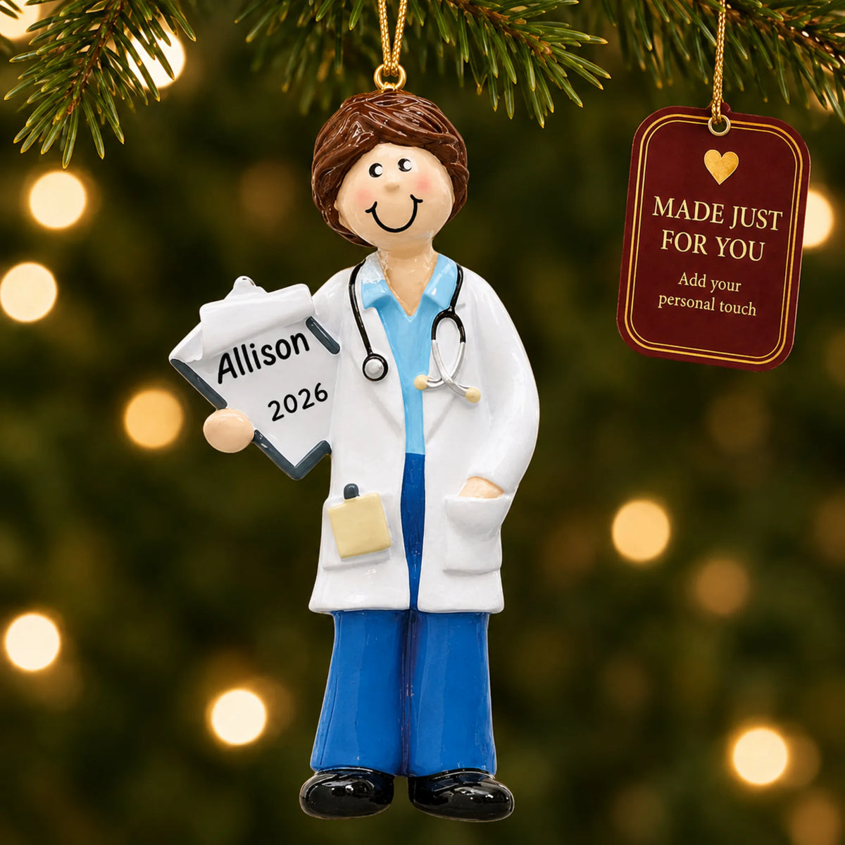 Doctor girl christmas ornament hanging on a lit Christmas tree with a Made Just For You gift tag