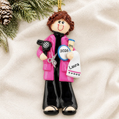 Personalized hairdresser stylist christmas ornament laid on a soft white knit blanket