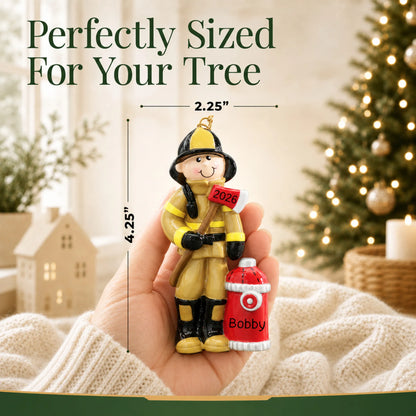 Size guide: the personalized firefighter christmas ornament is 2.25 in wide by 4.25 in tall, shown in hand