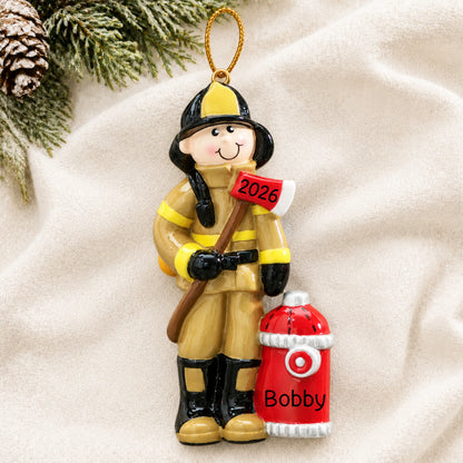 Personalized firefighter christmas ornament laid on a soft white knit blanket