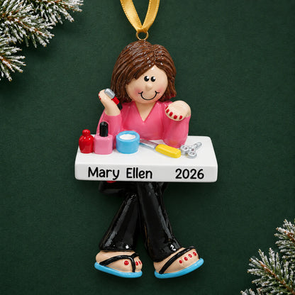 Personalized nail tech christmas ornament on a dark green pine background