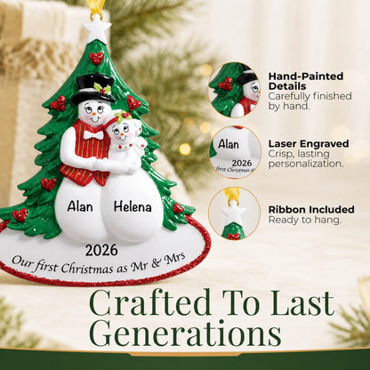Close-up of the personalized newlywed snow couple Christmas ornament: hand-painted detail, laser engraving