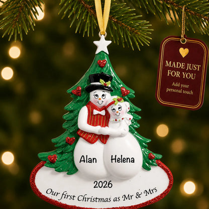 Personalized newlywed snow couple Christmas ornament on a lit Christmas tree with a Made Just For You tag