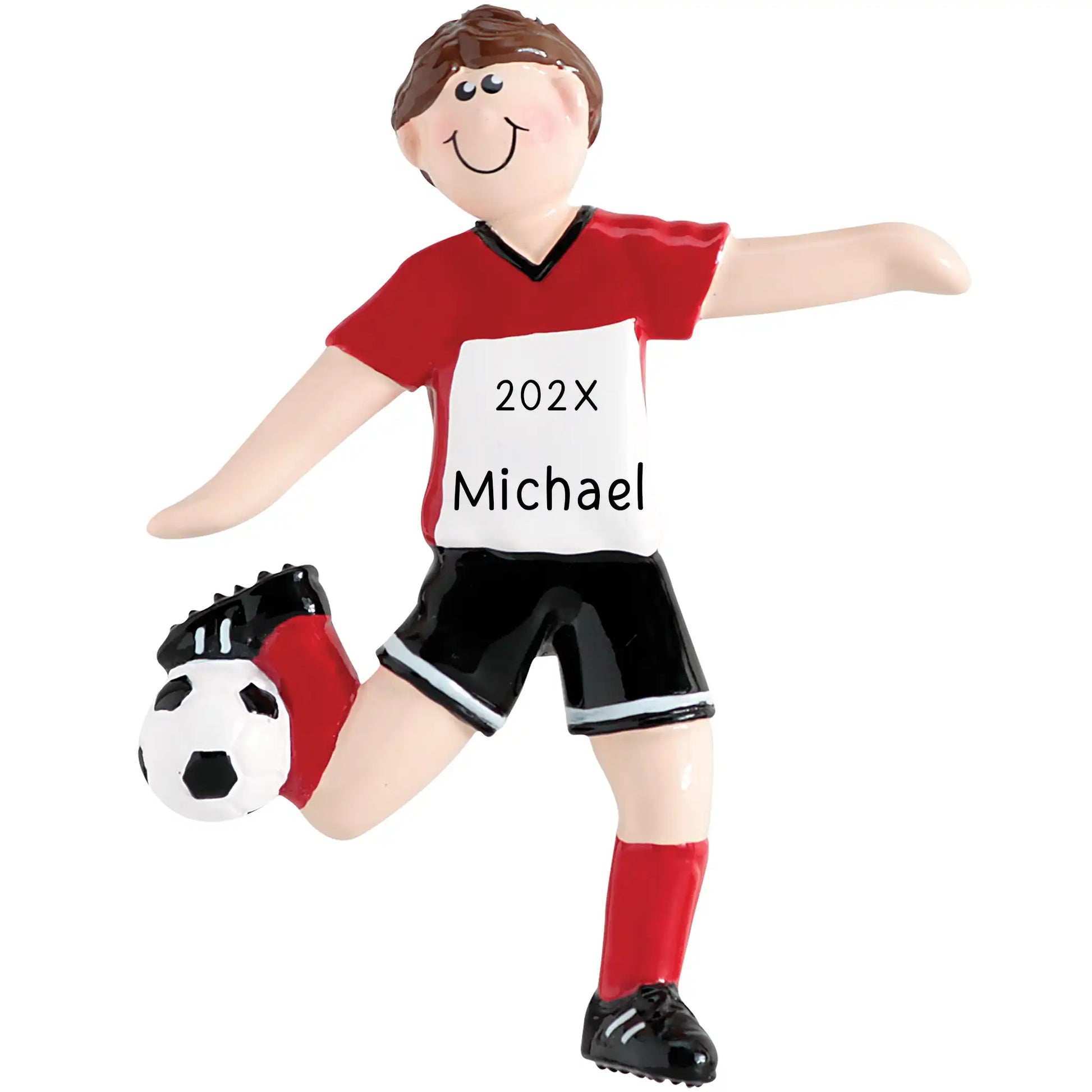 A personalized holiday ornament depicting a boy in a red and white soccer uniform with a ball and shin guards. The ornament has a smiling face and the text '202x Michael' on the front.