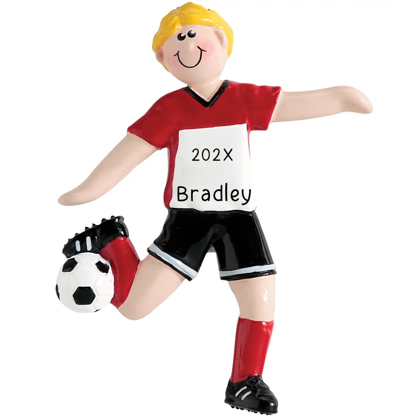 A personalized holiday ornament depicting a blonde-haired boy in a red and white soccer uniform with a ball and shin guards.