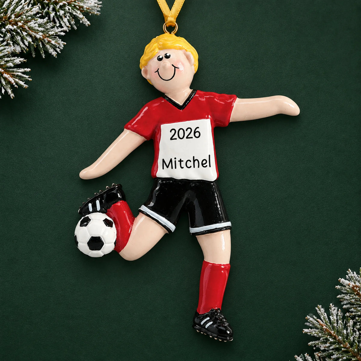 Personalized blonde soccer guy christmas ornament on a dark green pine background