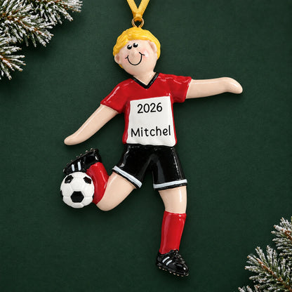 Personalized blonde soccer guy christmas ornament on a dark green pine background