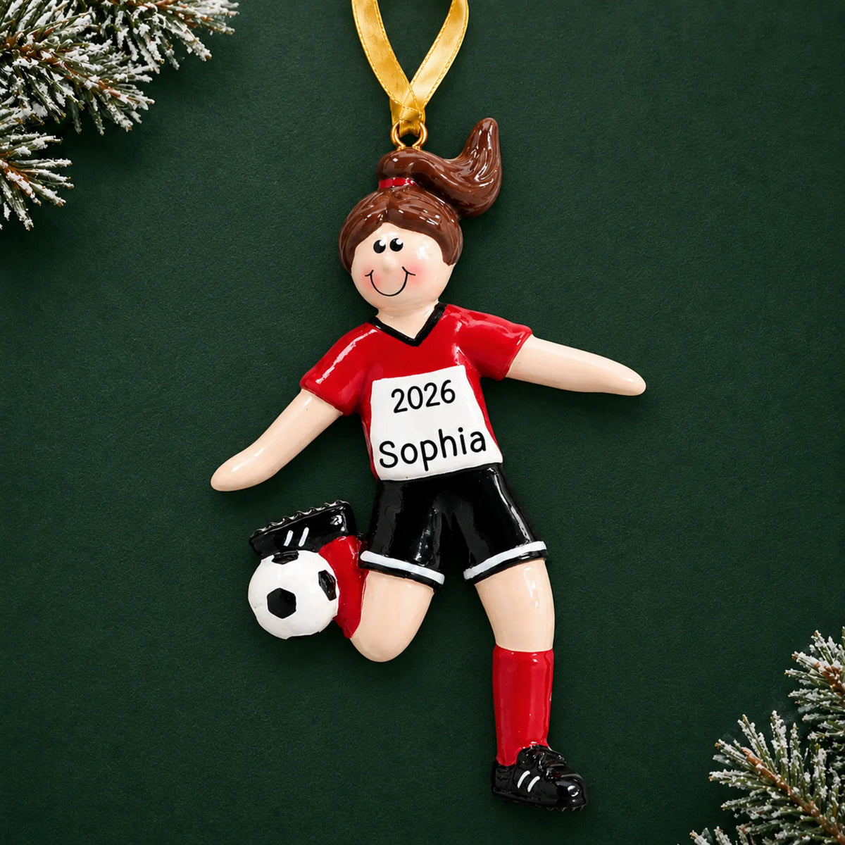 Personalized brunette soccer girl christmas ornament on a dark green pine background