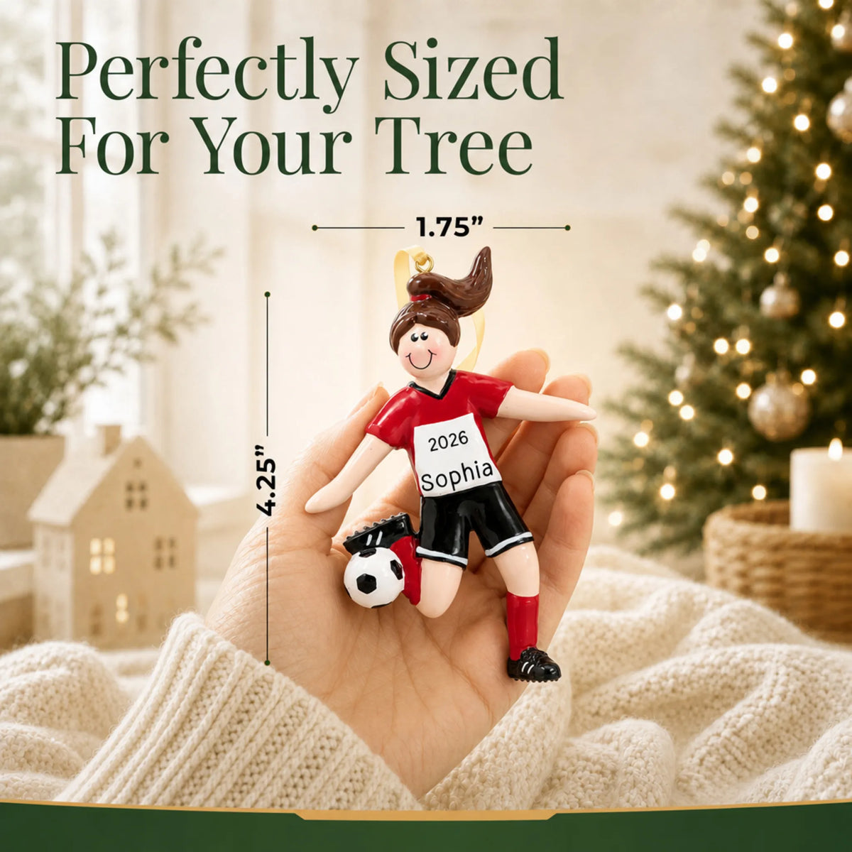 Size guide: the personalized brunette soccer girl christmas ornament is 1.75 in wide by 4.25 in tall, shown in hand