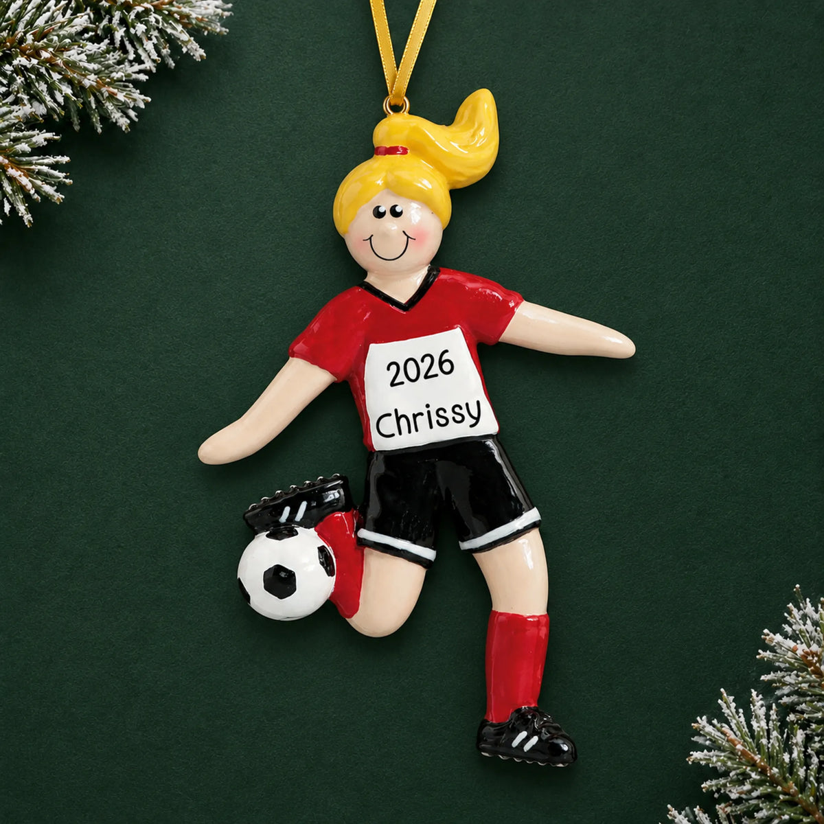 Personalized blonde soccer girl christmas ornament on a dark green pine background