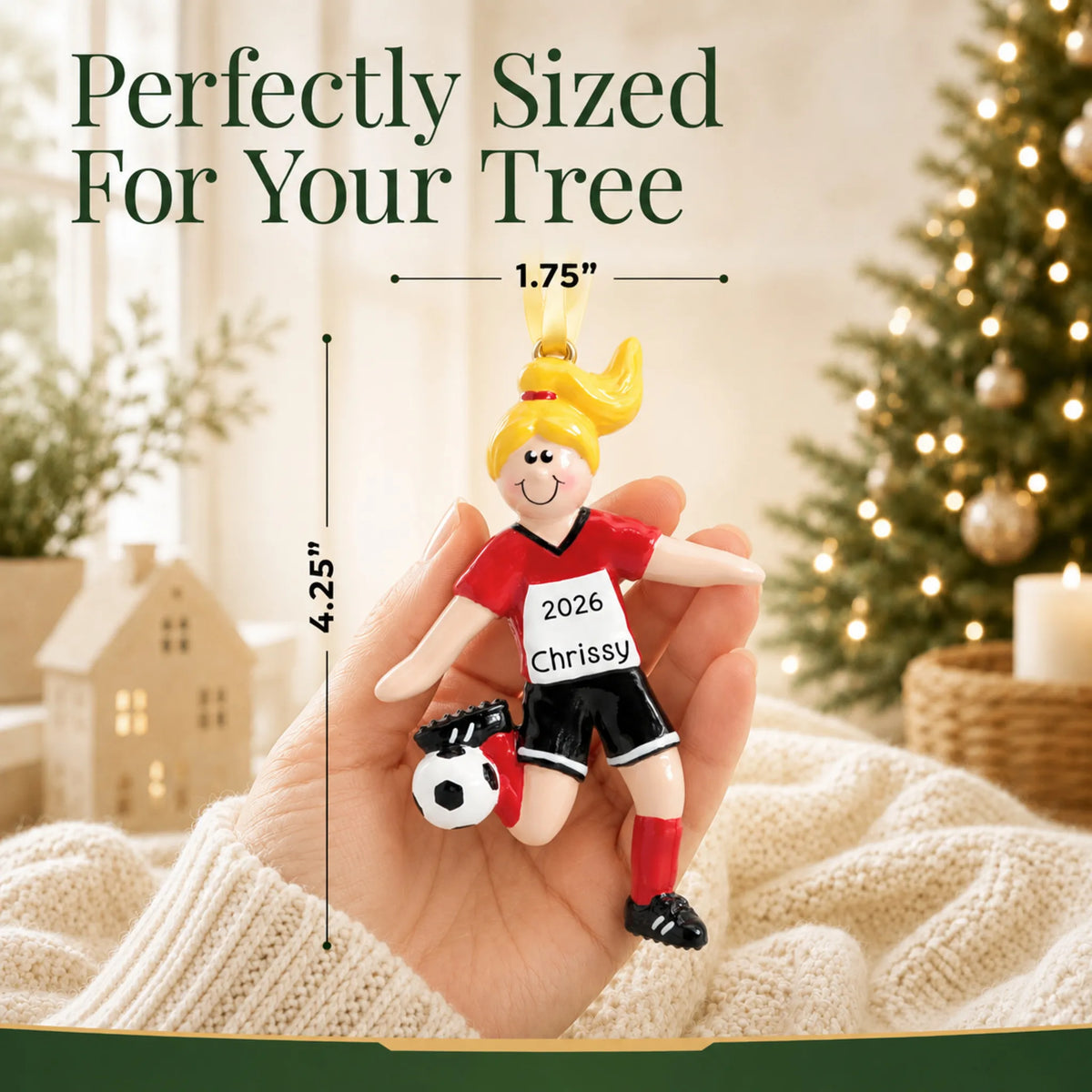 Size guide: the personalized blonde soccer girl christmas ornament is 1.75 in wide by 4.25 in tall, shown in hand