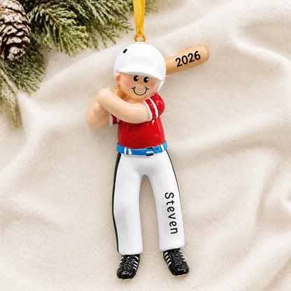 Personalized baseball boy batter christmas ornament laid on a soft white knit blanket