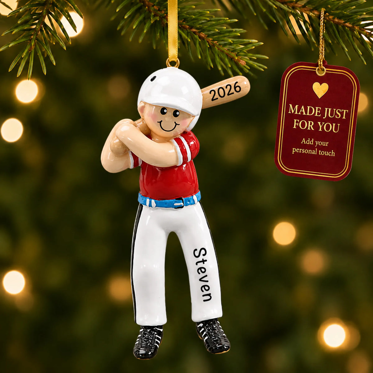 Baseball boy batter christmas ornament hanging on a lit Christmas tree with a Made Just For You gift tag