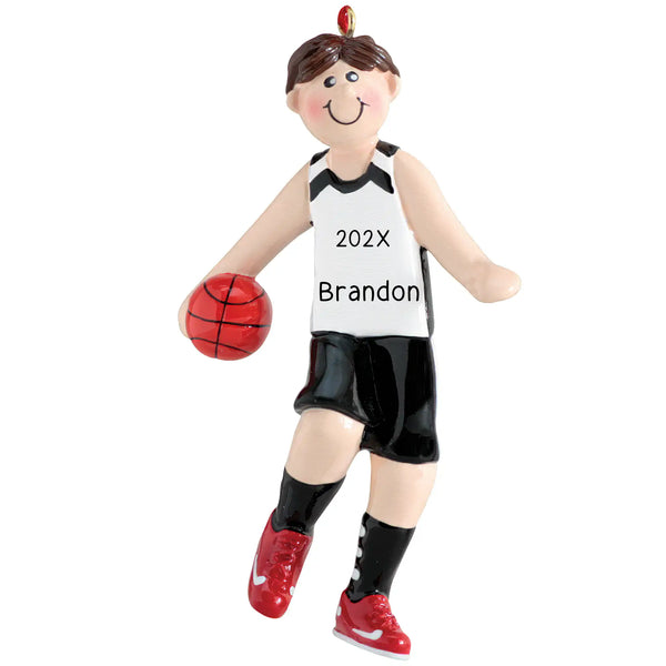 A personalized Christmas ornament featuring a boy basketball player in a red and white uniform with a basketball, and the text '202X BRANDON' on the back of the jersey.