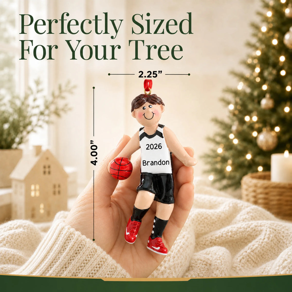 Size guide: the personalized basketball boy christmas ornament is 2.25 in wide by 4.00 in tall, shown in hand