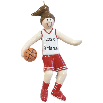 A personalized Christmas ornament featuring a basketball girl in a red and white uniform with '202X Briana' printed on the white jersey, dribbling a basketball.